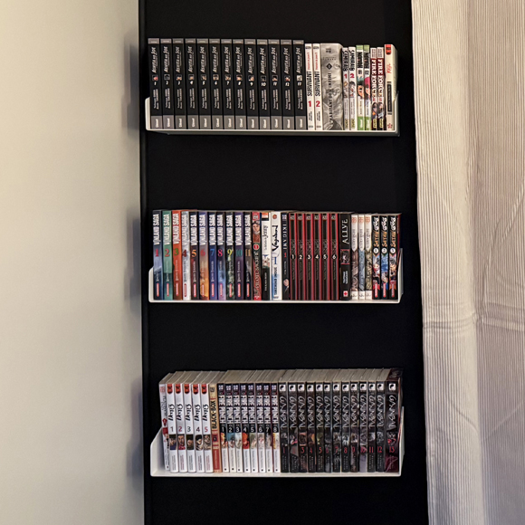 Bibliothèque murale suspendue pour mangas - Delta+